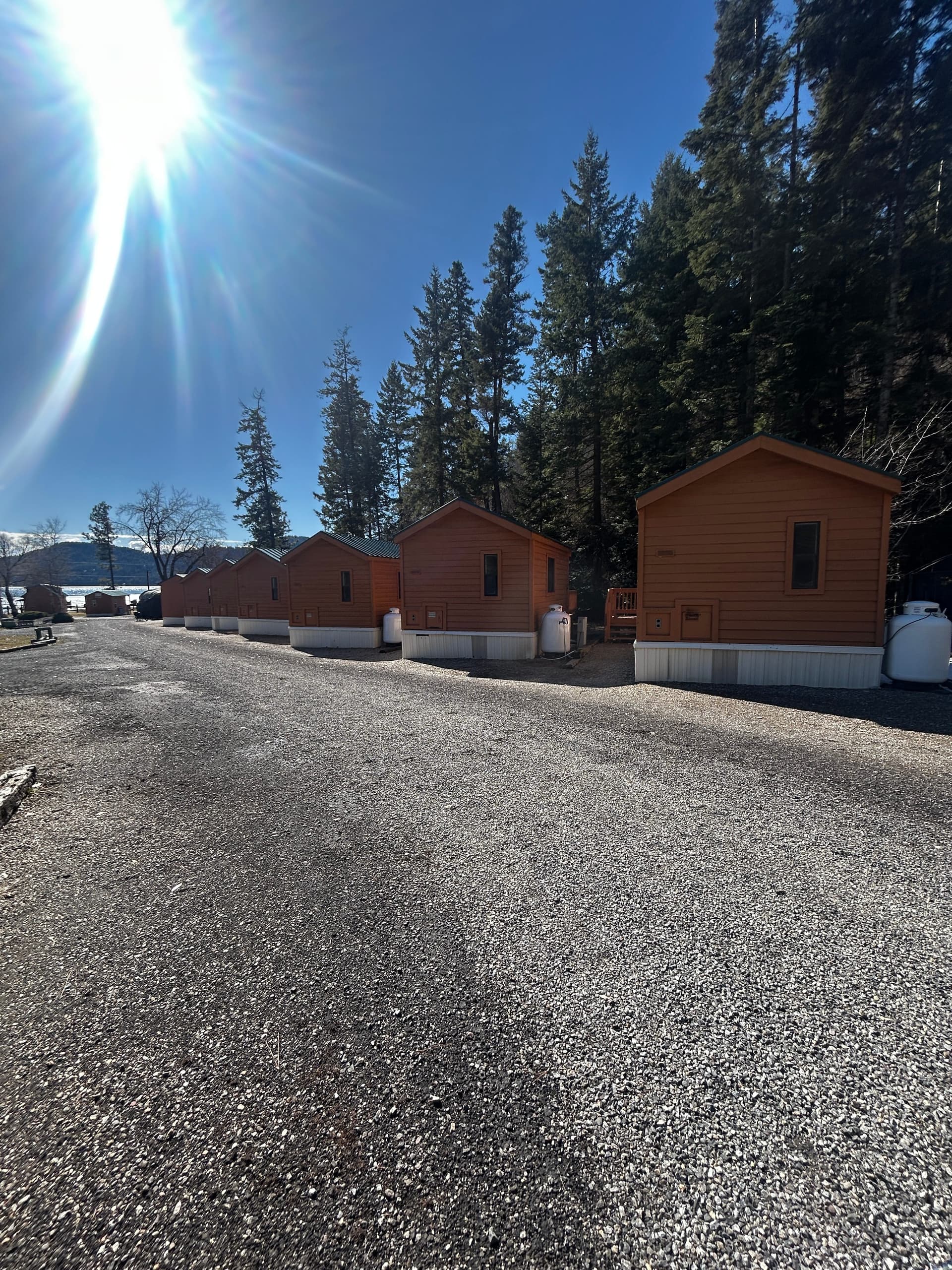 Cabin row with sun flare