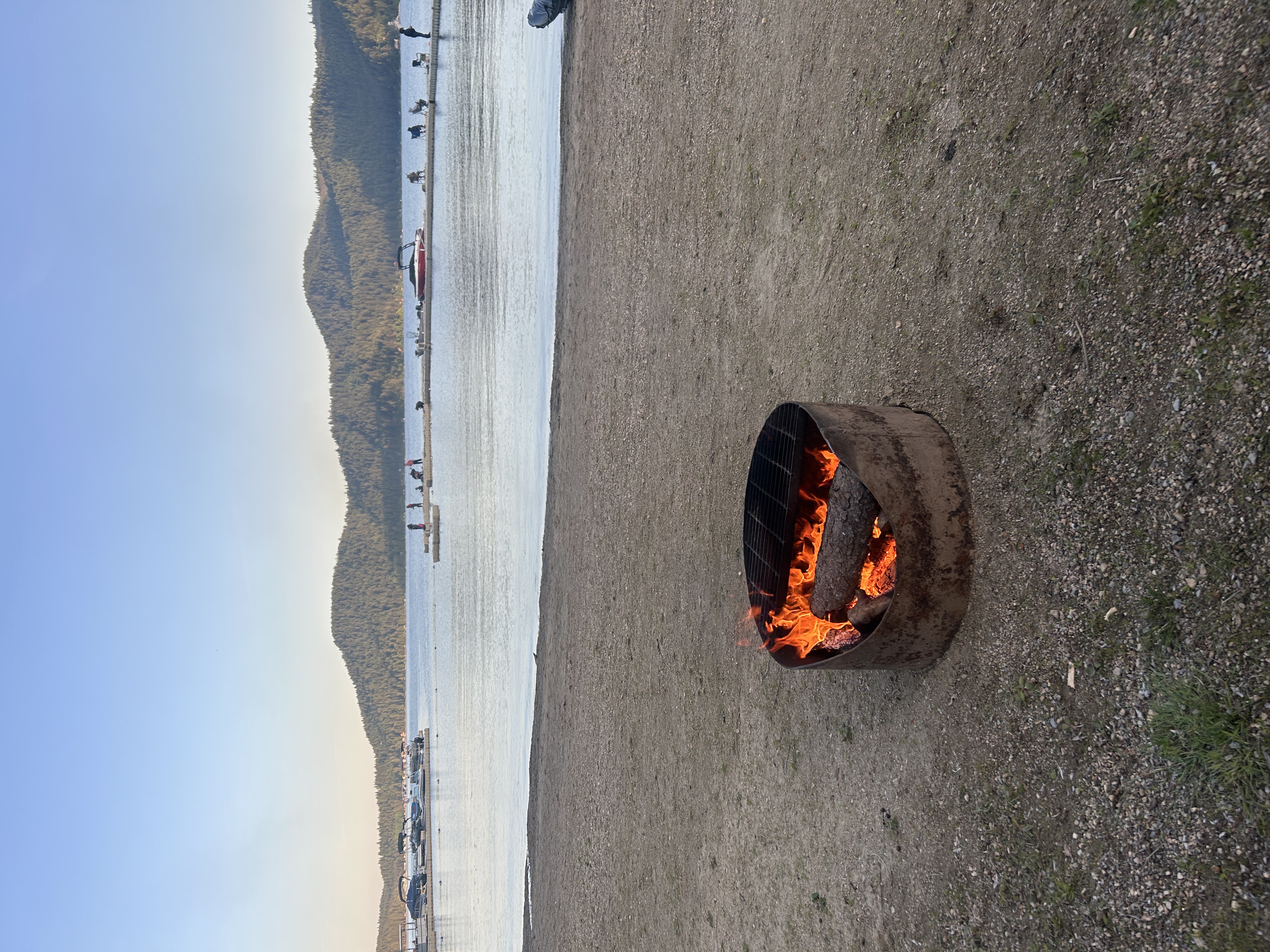 Beach fire pit with lake and mountain views